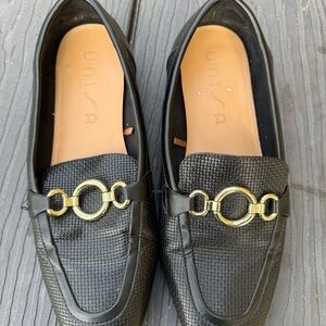 Unisa Black Loafers with Gold Accents